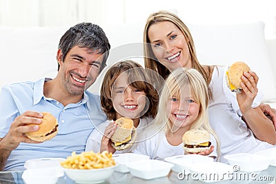 Family eating hamburgers Stock Photo