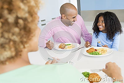 Family Eating A meal,mealtime Together Stock Photo