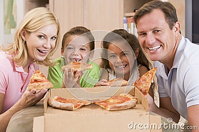 Family Eating Pizza Together Stock Photo