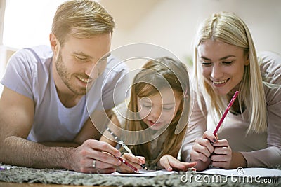 Educate. Family at home together. Stock Photo