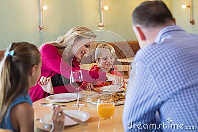 Family enjoying appetizer in restaurant Stock Photo