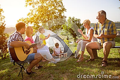 Family enjoying camping holiday Stock Photo
