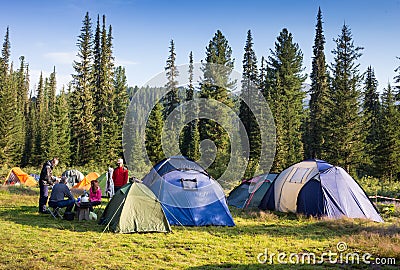 Family Enjoying Camping Holiday In Countryside Stock Photo