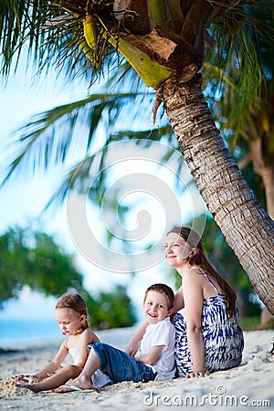 Family enjoying evening at beach Stock Photo