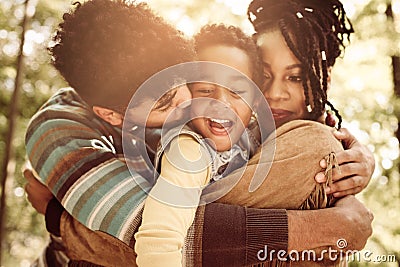 Family enjoying in hug together in nature. Stock Photo