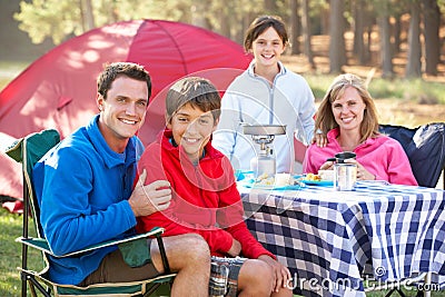 Family Enjoying Meal On Camping Holiday Stock Photo