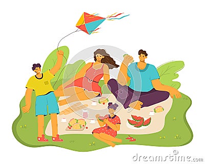 Family enjoying picnic green grass, children parents eating, flying kite. Young boy flies colorful Stock Photo