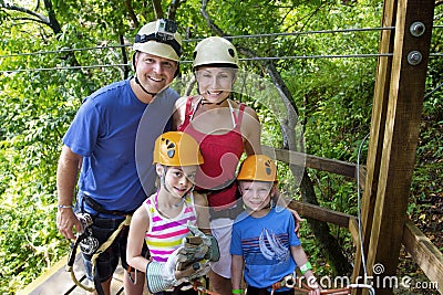 Family enjoying a Zipline Adventure on Vacation Stock Photo