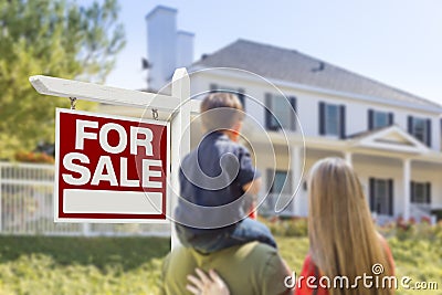 Family Facing For Sale Real Estate Sign and House Stock Photo