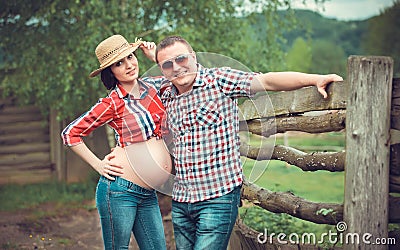 Family of farmers waiting baby Stock Photo