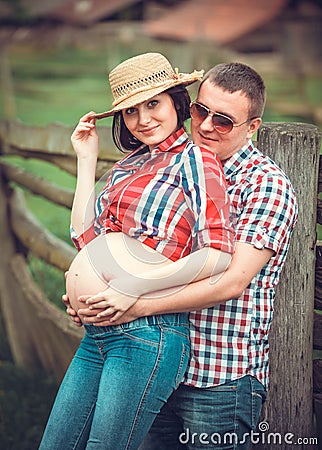 Family of farmers waiting baby Stock Photo