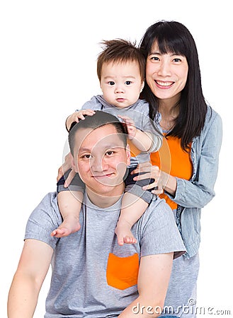 Family with father giving piggyback with baby son Stock Photo