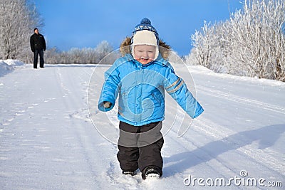 family, father and happy small child the boy on walk in the winter Stock Photo