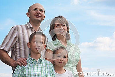 Family. father, mother, little boy and girl on sky Stock Photo