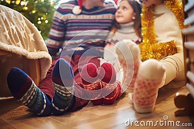 Family feet in wool socks Stock Photo