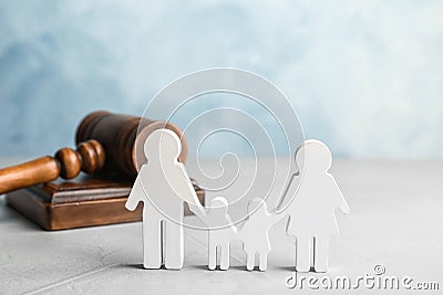 Family figure and gavel on table Stock Photo