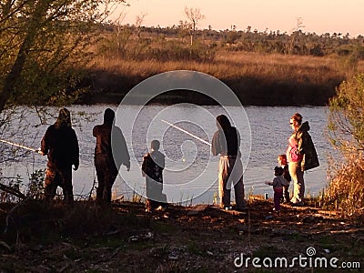 Family Fishing on the riverbank on the Bayou Editorial Stock Photo