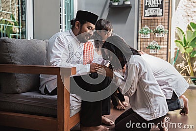 Family forgiving and apologizing each other. eid mubarak Stock Photo