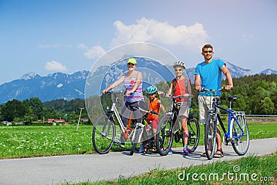 Family Of Four Cycling Stock Photo