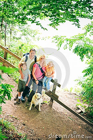 Family Of Four Hiking Stock Photo