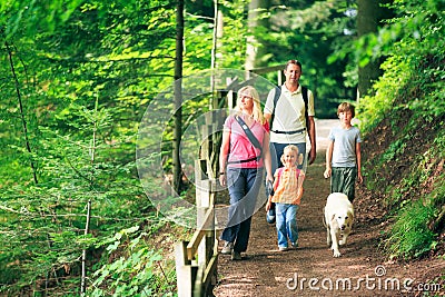 Family Of Four Hiking Stock Photo