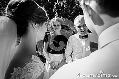 Family and friends congratulating stylish luxury newlyweds at we Stock Photo