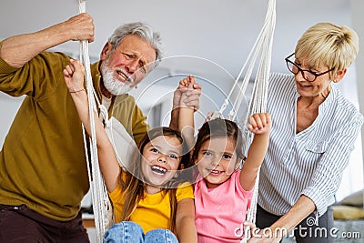 Family, generation love and people concept. Happy grandparent having fun with children at home Stock Photo