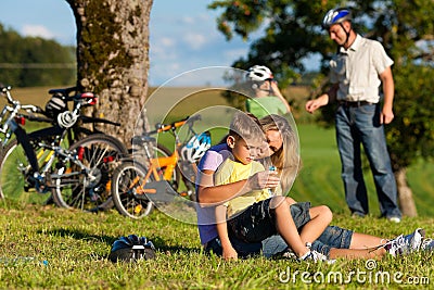 Family on getaway with bikes Stock Photo