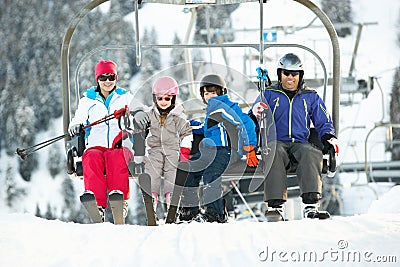 Family Getting Off Chair Lift On Holiday Stock Photo