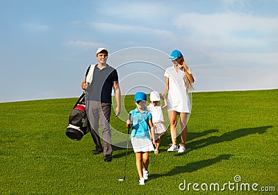 Family of golf players at the course Stock Photo