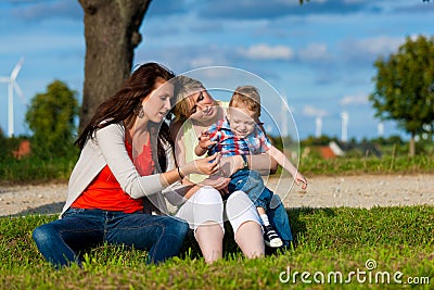 Family - Grandmother, mother and child in garden Stock Photo