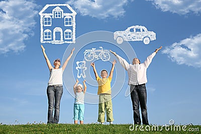 Family on grass with hands up and dream, collage Stock Photo