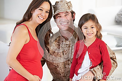 Family Greeting Military Father Home On Leave Stock Photo