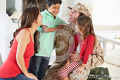 Family Greeting Military Father Home On Leave Stock Photo