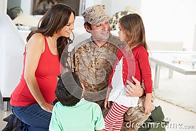 Family Greeting Military Father Home On Leave Stock Photo