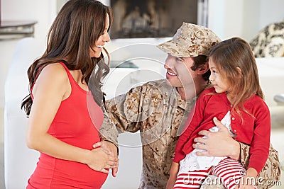 Family Greeting Military Father Home On Leave Stock Photo