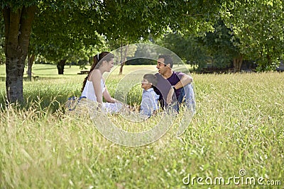 Family with happy young man, woman and child playing Stock Photo