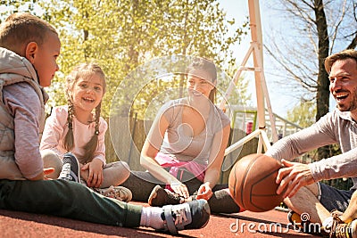 Family having break after games. Stock Photo