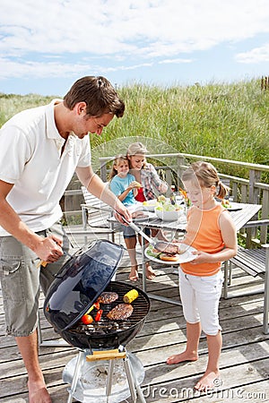 Family having burgers off the grill Stock Photo