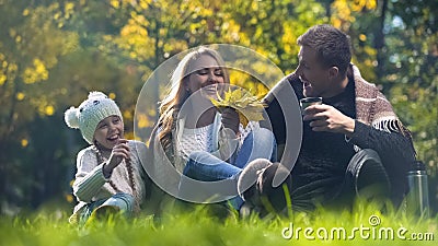 Family having fun on picnic in autumn forest, conscious parenthood, wellbeing Stock Photo