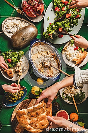 Flat-lay of people having Turkish style dinner for Ramazan supper Stock Photo