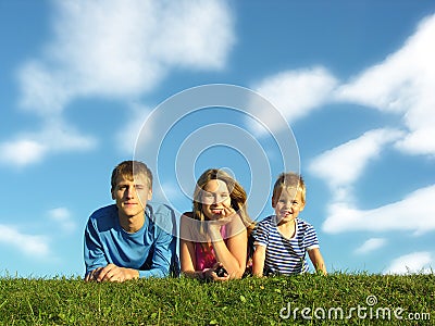 Family on herb under blue sky Stock Photo