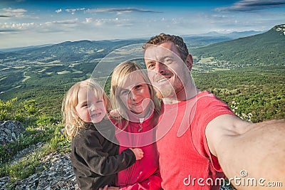 Family hikers making selfie mountain valley background Stock Photo