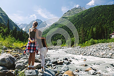 Family hikers walking to mountains Stock Photo
