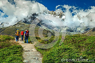 Family hiking in high mountains, Switzerland, Europe Editorial Stock Photo