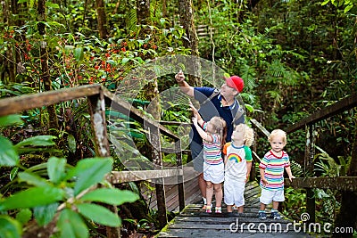 Family hiking in jungle. Stock Photo