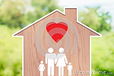 Family home with dad, mom and children with love icons on a natural background Stock Photo