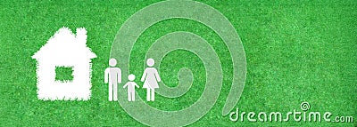 Family and home icon on green artificial grass. Stock Photo