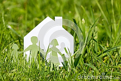 Family with house in a green grass Stock Photo