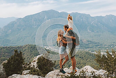 Family hugging couple with child traveling outdoor hiking in mountains with kid Stock Photo